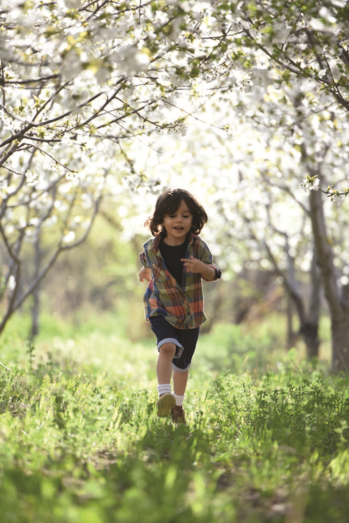 Preschool student running in a field